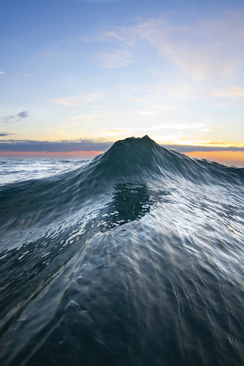 a wave at Kokololio beach on Oahu's east side.