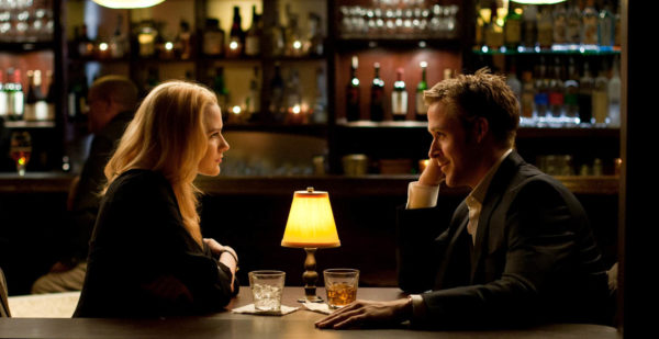 Stephen (Ryan Gosling) and Molly (Evan Rachel Wood) have a drink and talk in the motel bar in Columbia Pictures' IDES OF MARCH.
