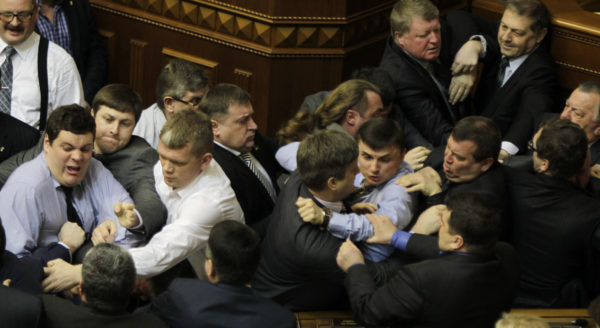 Ukrainian opposition and majority lawmakers fight around the rostrum during the session of parliament in Kiev, Ukraine, on Tuesday.